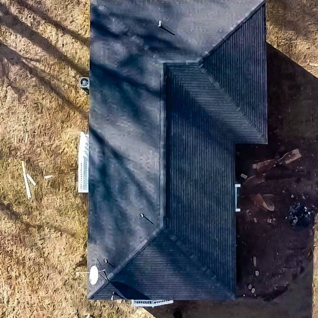 Top-down view of a new charcoal shingle roof in Madison, MS